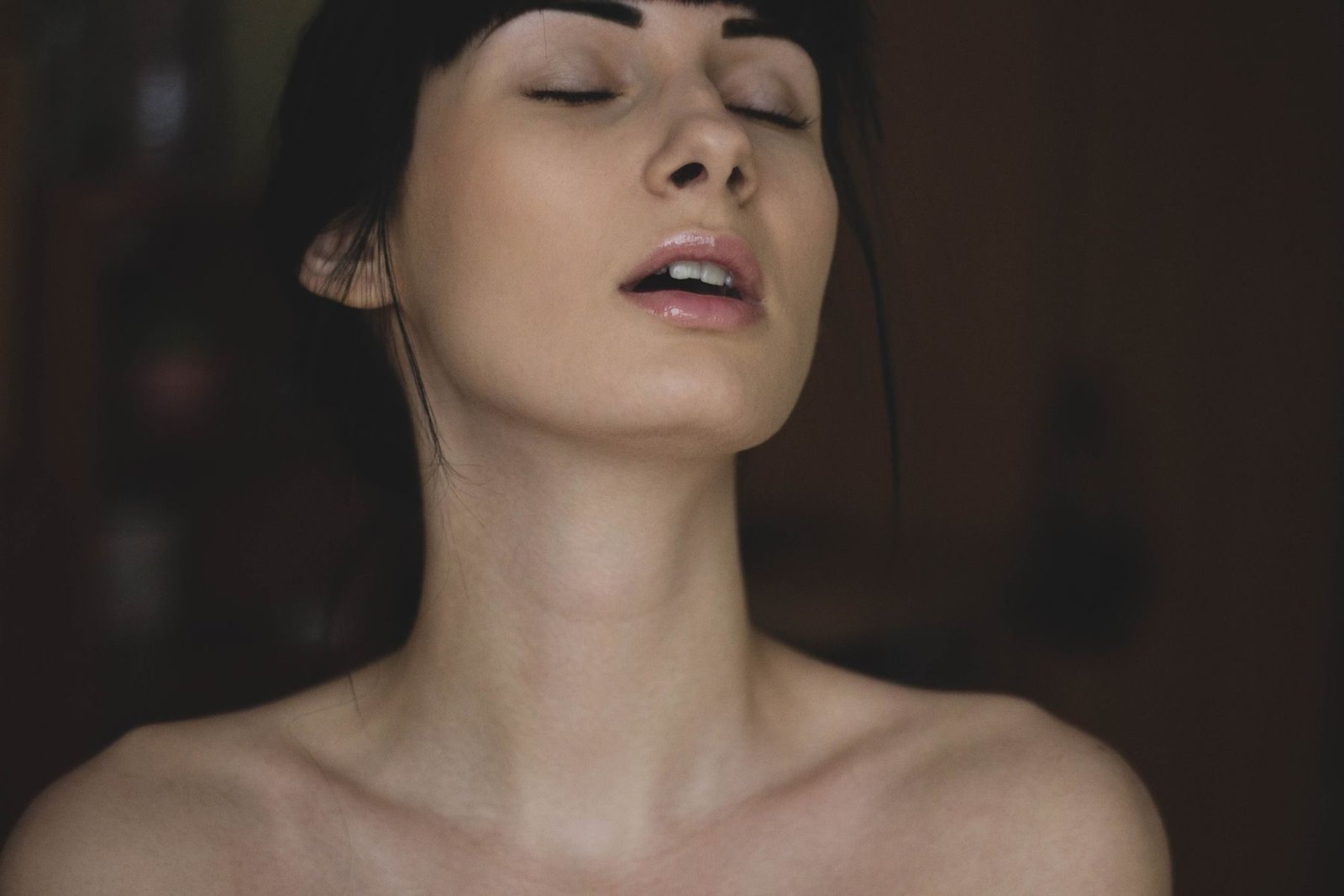 A face at rest in warm light